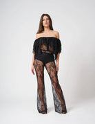 Pantalone in pizzo trasparente