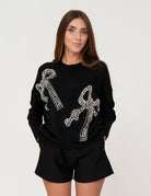 Maglia con fiocchi in strass