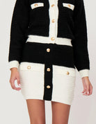 Gonna corta con bottoni