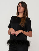 Blusa con piume