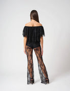Pantalone in pizzo trasparente